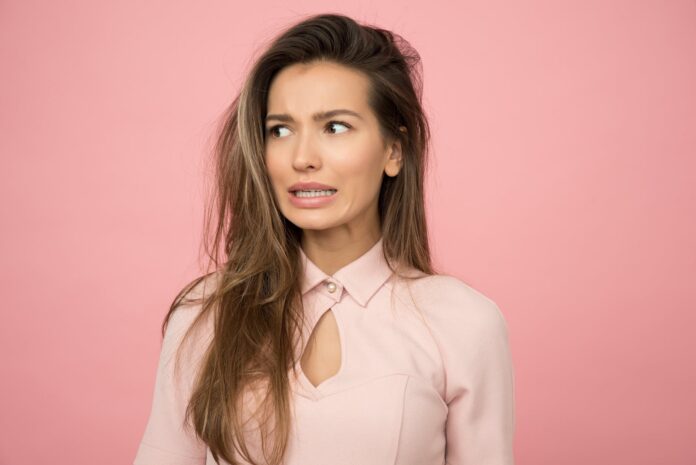 woman wearing pink top