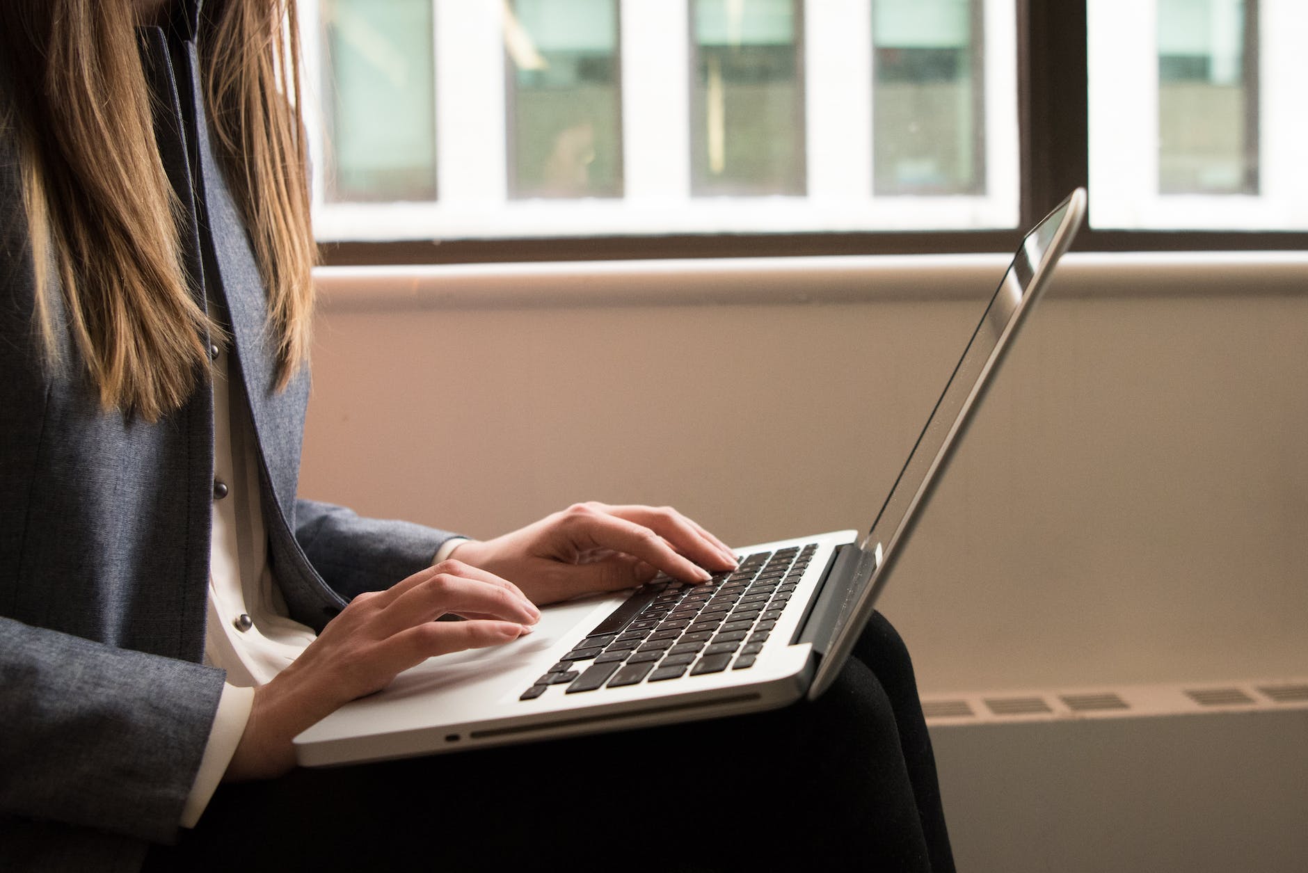 woman using macbook pro