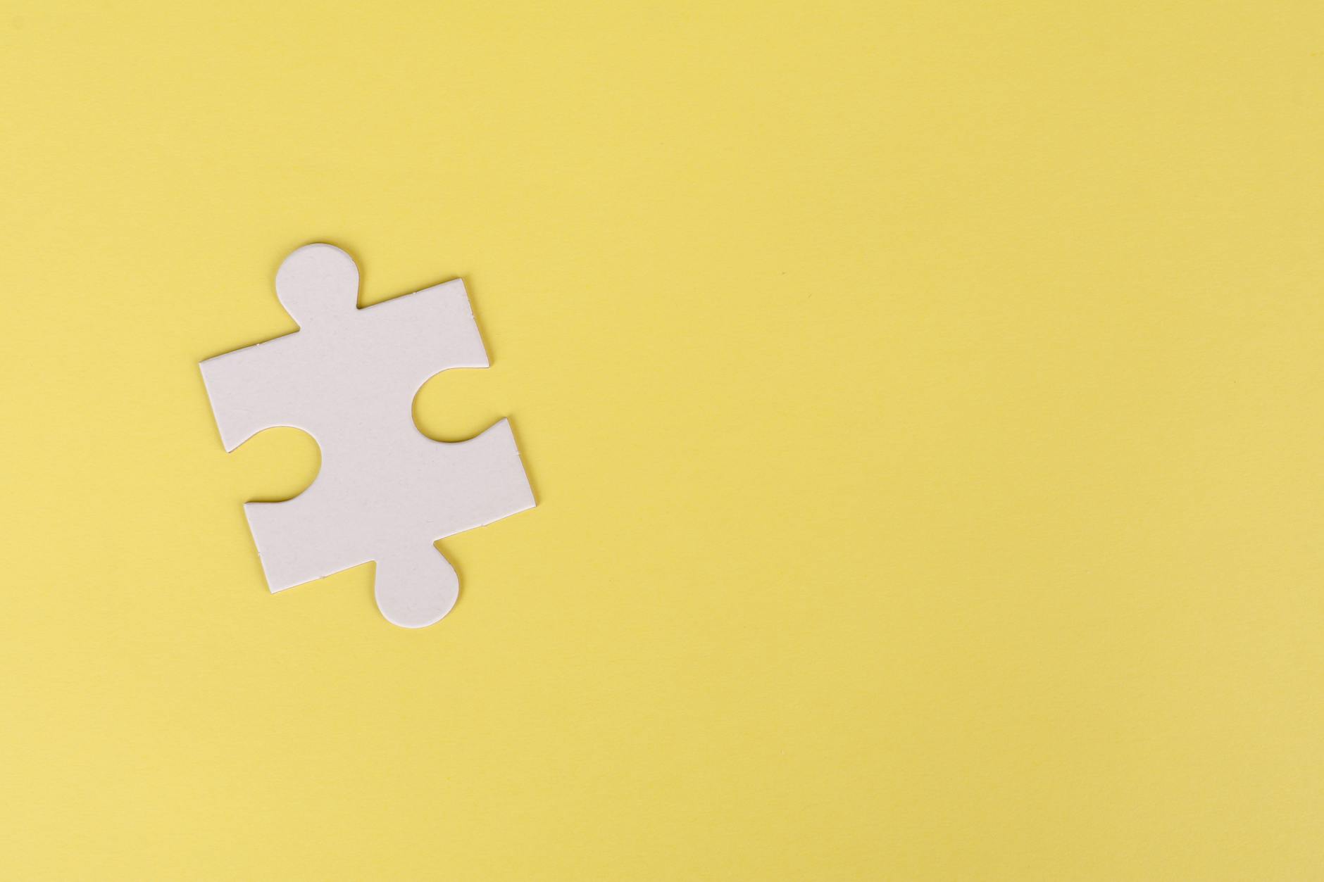 jigsaw puzzle on yellow background