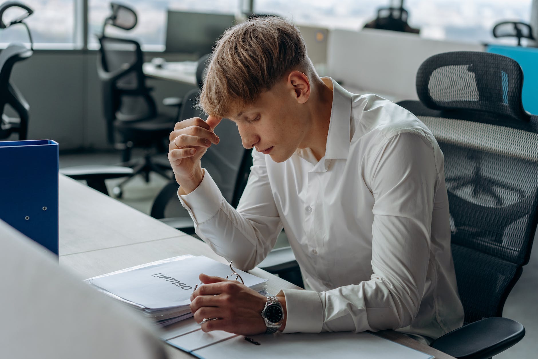 young office worker reading documents